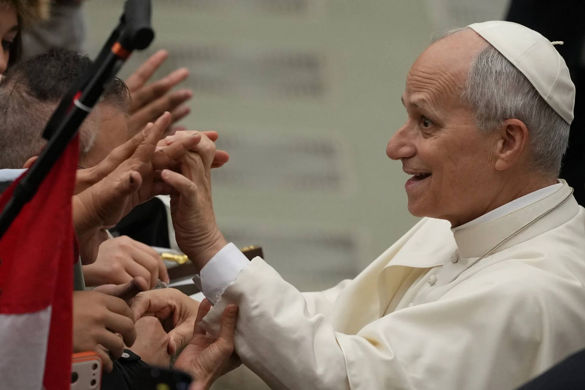 Pope Leo XIV greets people during his weekly general audience in the Pope Paul VI hall at the Vatican, Wednesday, Jan. 14, 2026. (Credit: Andrew Medichini/AP.)