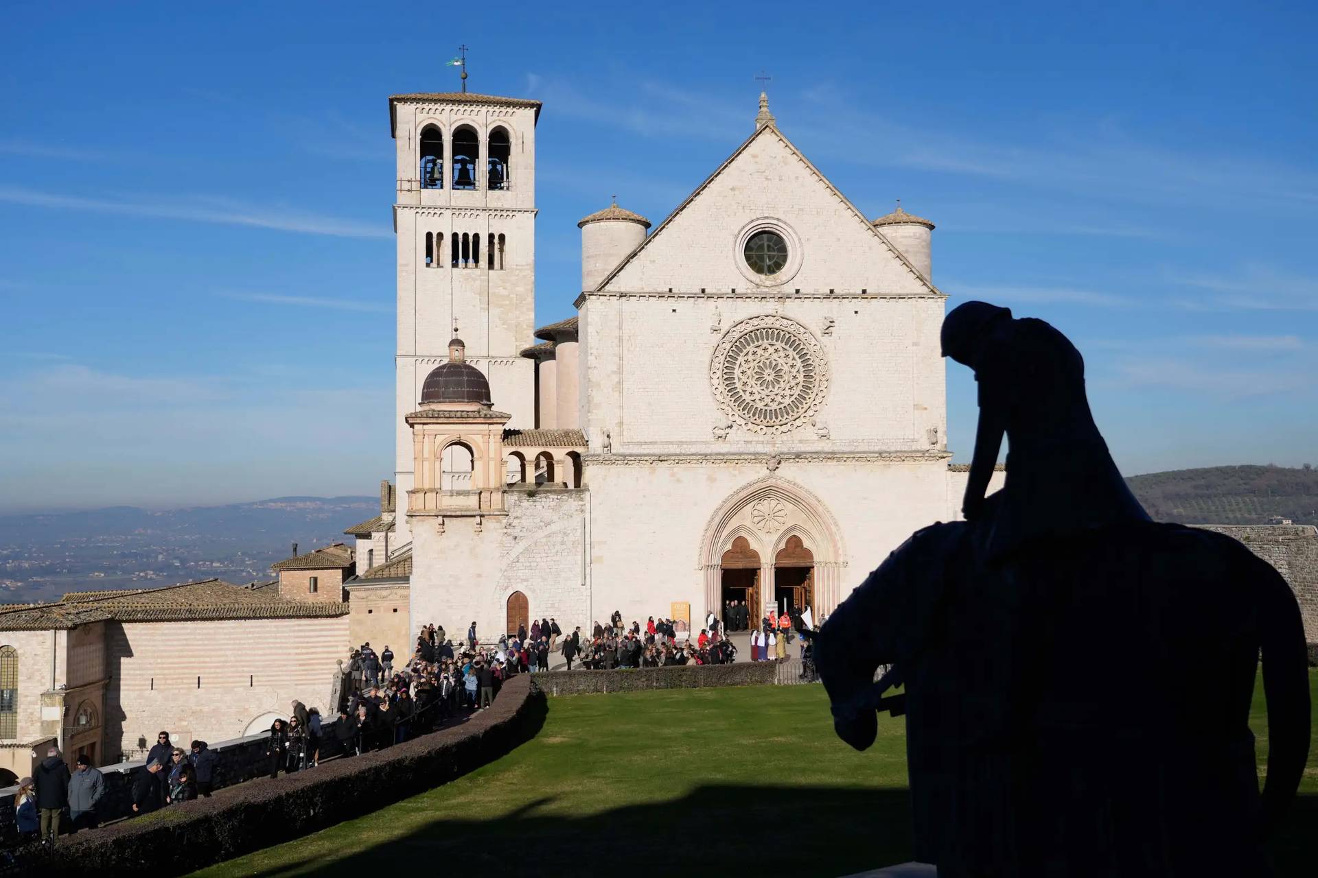 Friars pray before the remains of Francis of Assisi inside the Basilica of St. Francis of Assisi in Assisi, Italy, Saturday, Feb. 21, 2026, on the eve of a public exposition beginning Feb. 22 to mark the 800th anniversary of his death in 1226. (Credit: Gregorio Borgia/AP.)