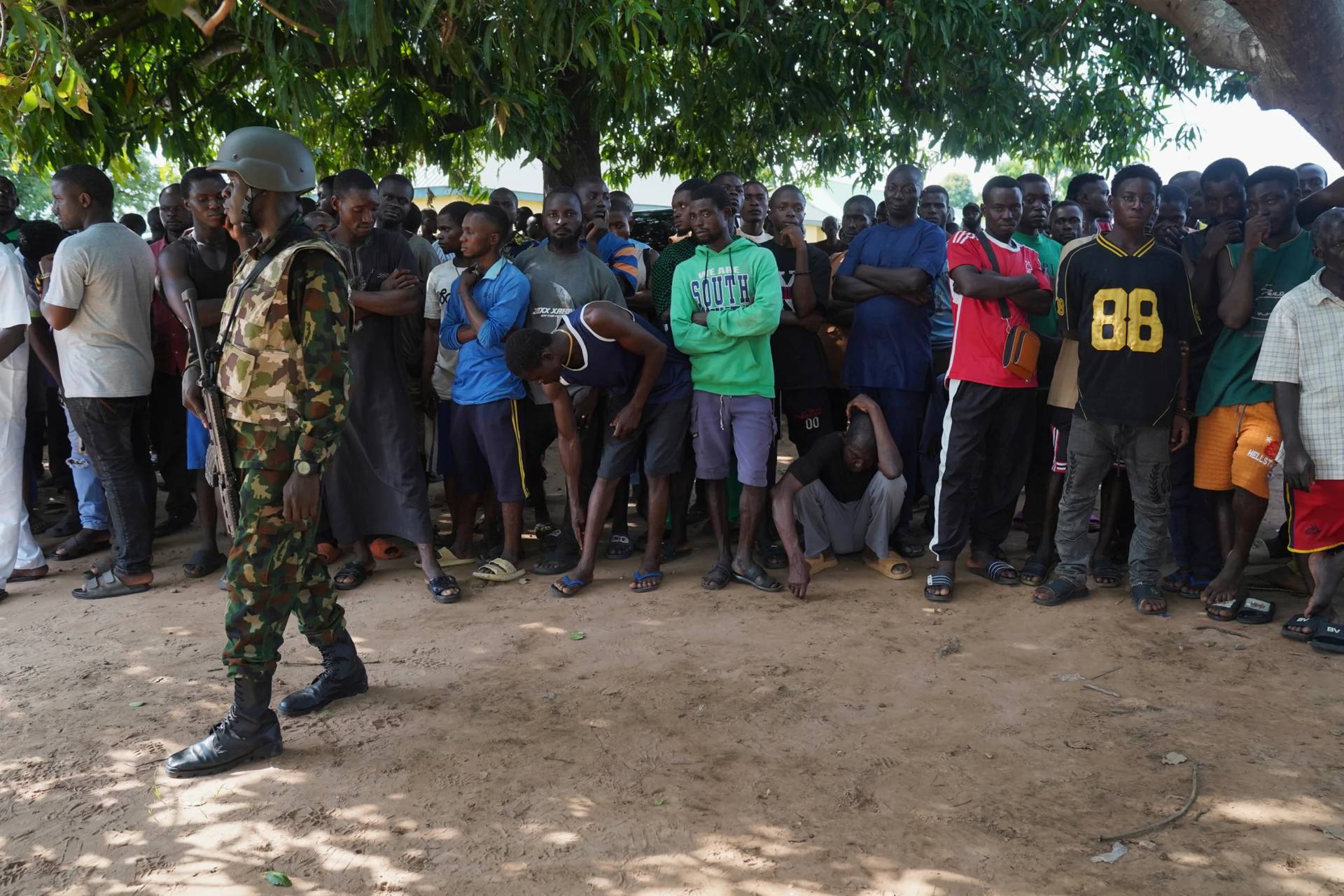 A soldier stands guard prior to the government officials visit following an attack by gunmen in Yelewata community in north-central Nigeria on June 16, 2025. (Credit: AP.)