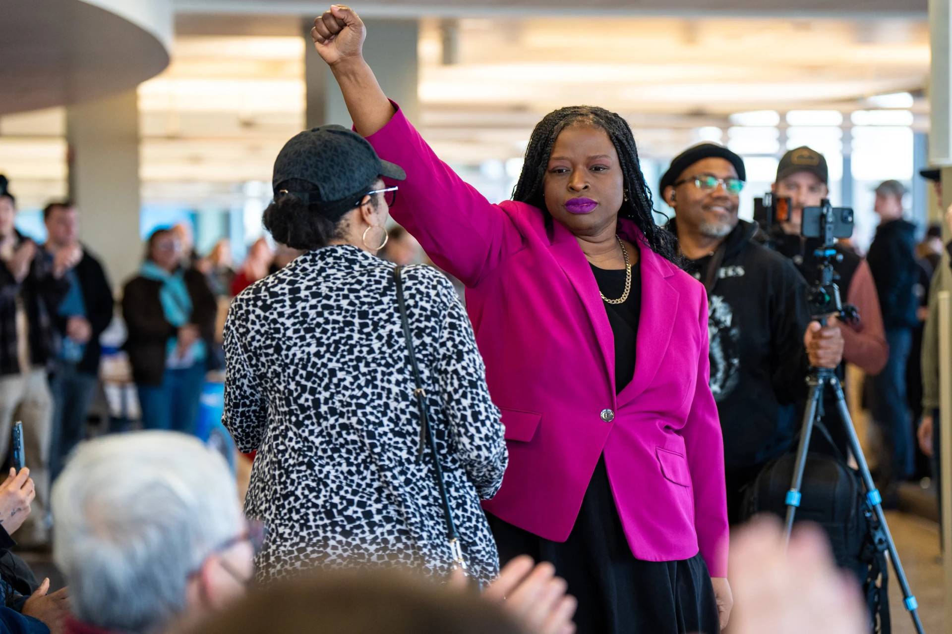 Nekima Levy Armstrong holds up her fist after speaking at an anti-ICE rally for Martin Luther King Jr., Monday, Jan. 19, 2026, in St. Paul, Minn. (Credit: Angelina Katsanis/AP.)