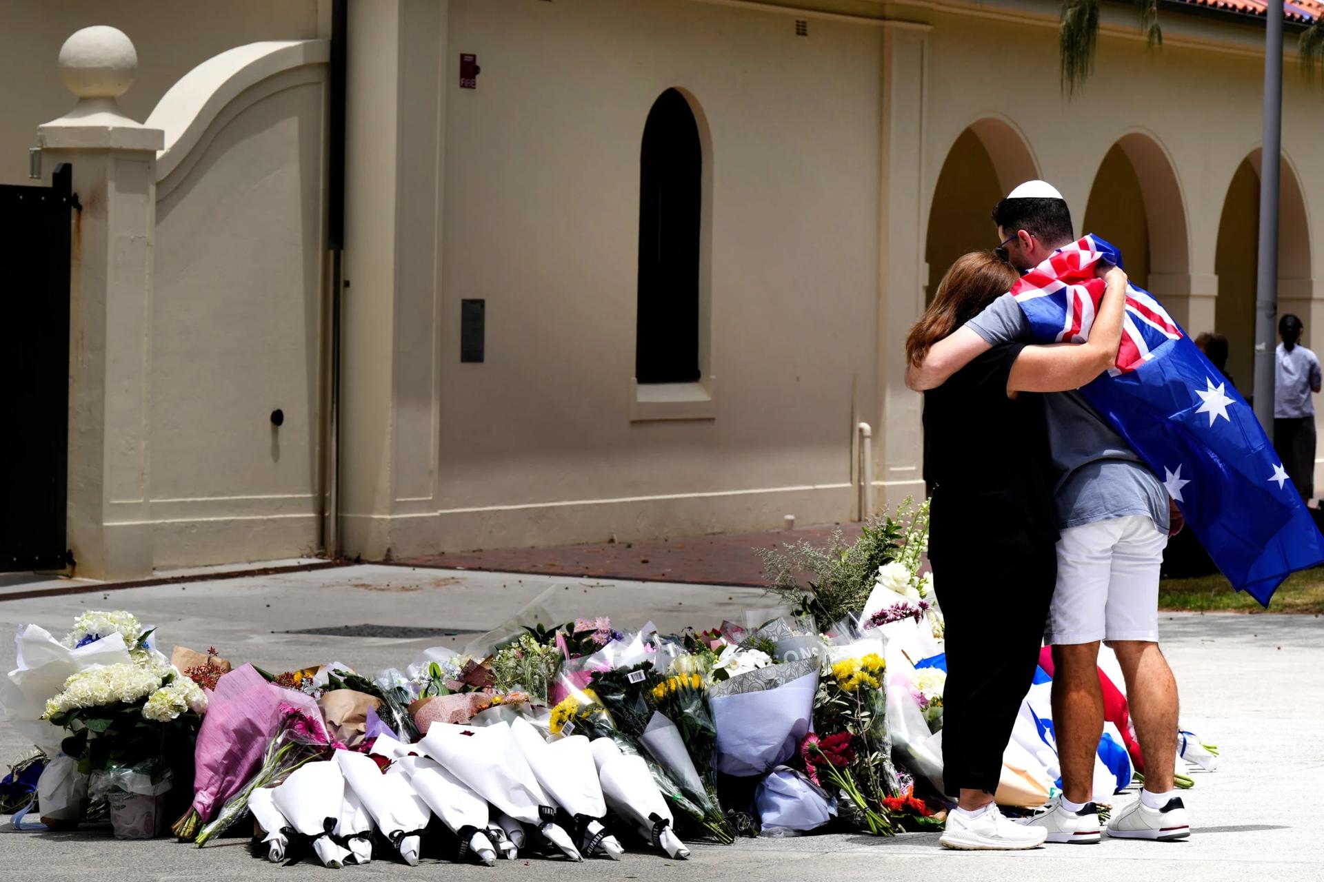 Father and son gunmen kill at least 15 people in attack on Hanukkah event at Sydney’s Bondi Beach
