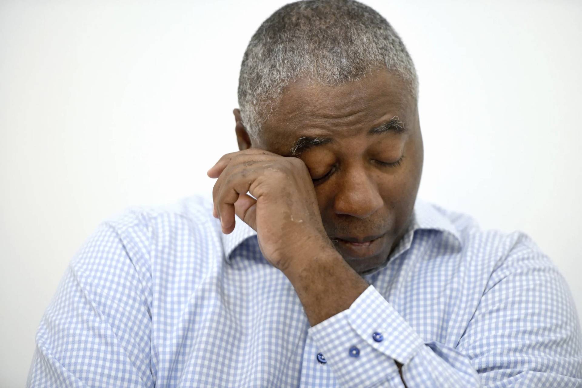 Charles Richardson, of Baltimore, wipes his eye while discussing his alleged abuse decades ago by a Catholic priest, in Baltimore on Wednesday, Sept. 20, 2023. Black victims have largely been invisible in the Catholic sexual abuse crisis. Richardson recently came forward after the state of Maryland removed the civil statute of limitations for child sex abuse victims. (Credit: Steve Ruark/AP.)